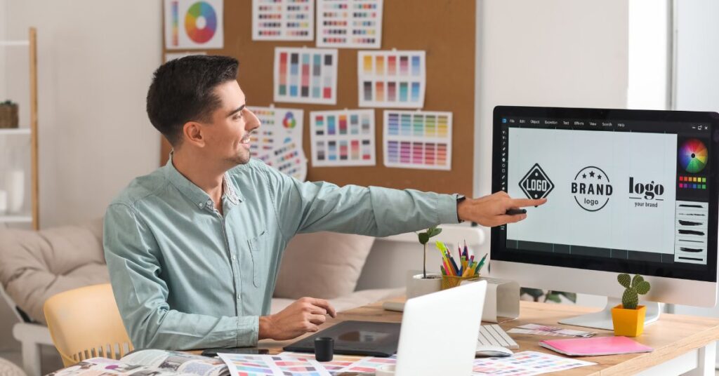 a man pointing at a computer screen
